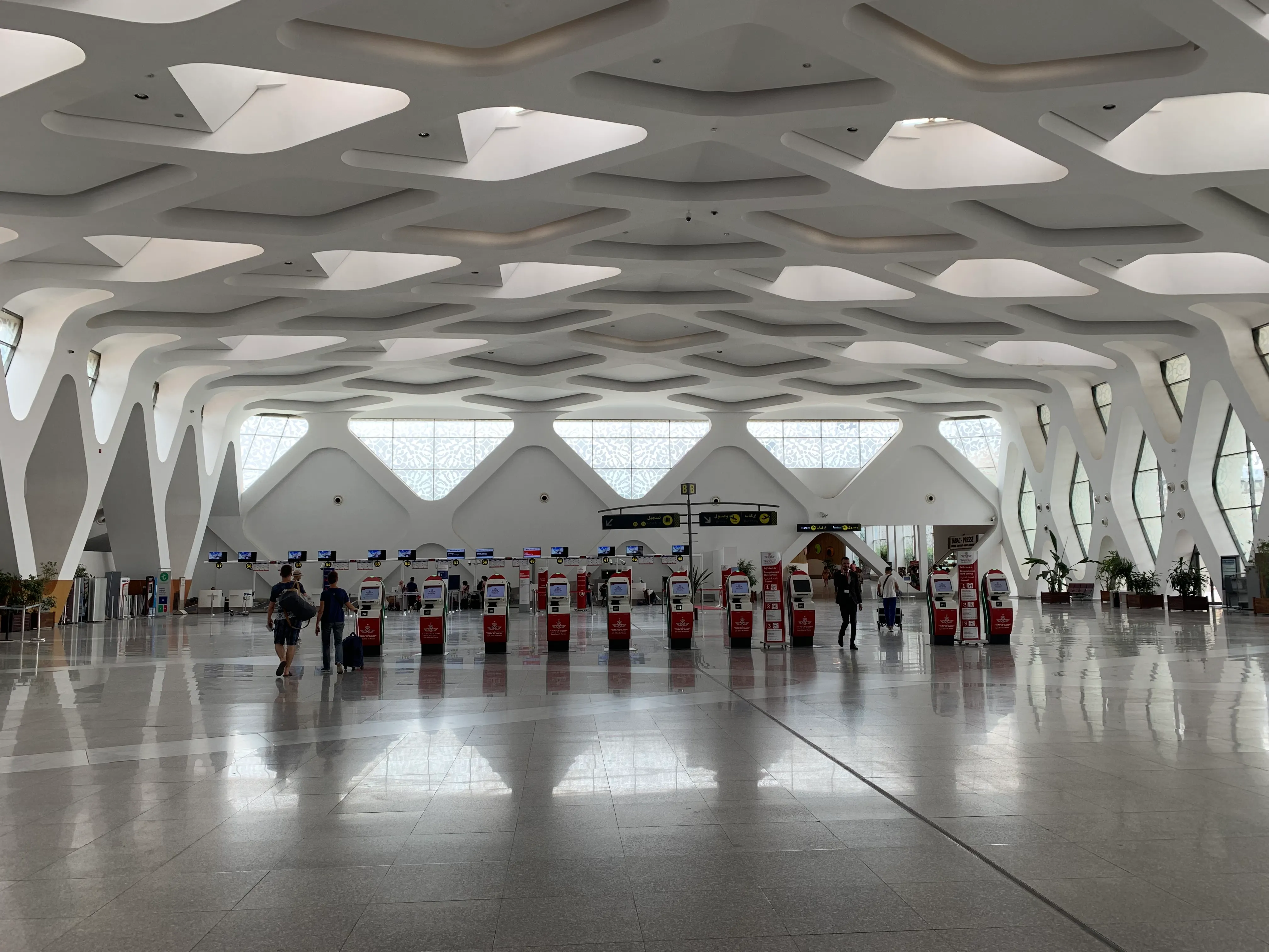 Car rental desks and vehicles at Marrakech Menara Airport